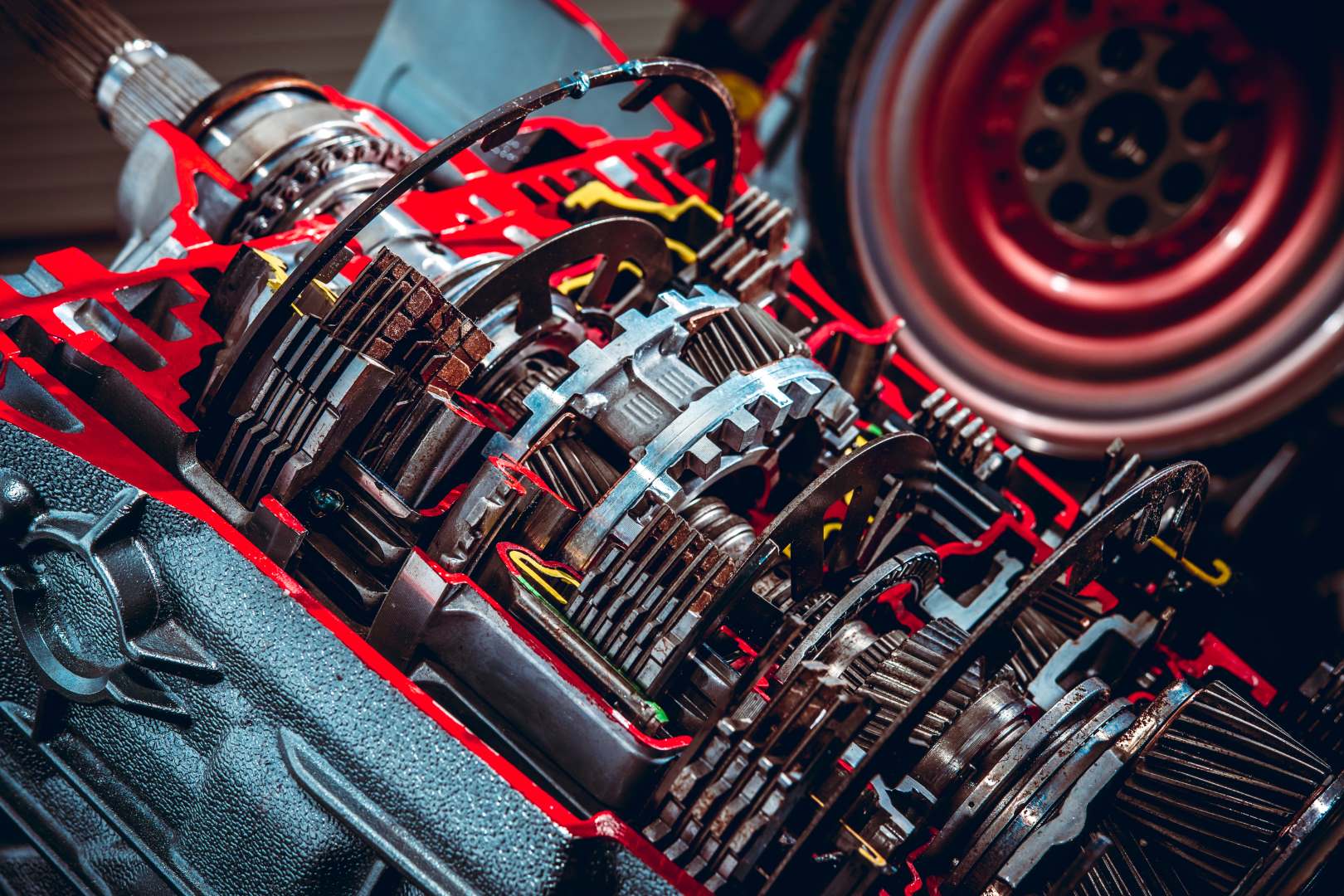 Parts from a vehicle gearbox. Shallow depth of field with the nearest gear in focus.